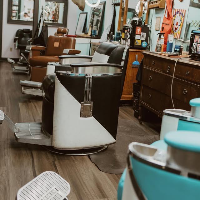 Vintage barber chairs lined up on the shop floor